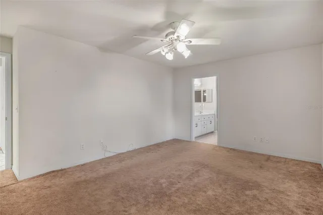 a bathroom with a double vanity sink a toilet and a mirror