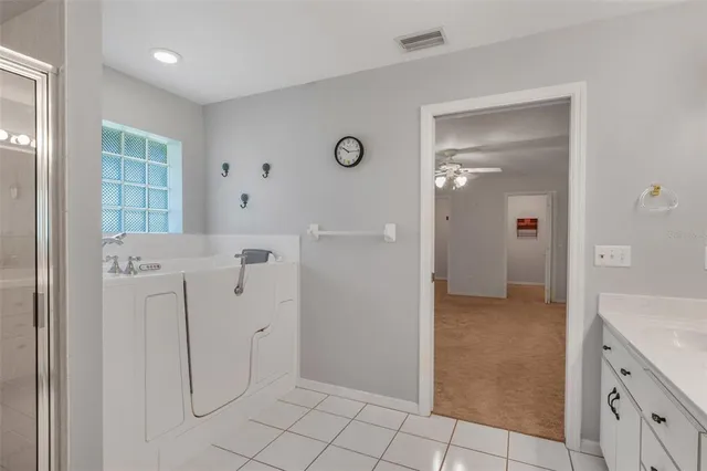 a swimming pool with outdoor seating and yard