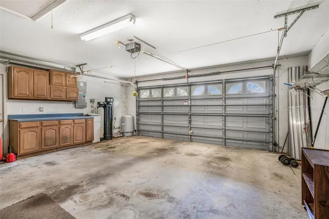 a aerial view of a house with yard and green space