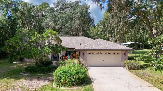 an aerial view of multiple house with a yard