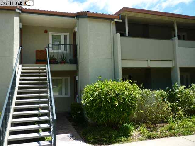 1505 Kirker Pass Road, Unit 260 Concord, CA 94521 - Photo 1 of 1 a view of a house with a flower garden