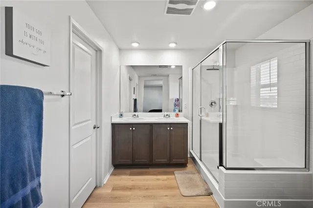 a bathroom with a mirror and a shower