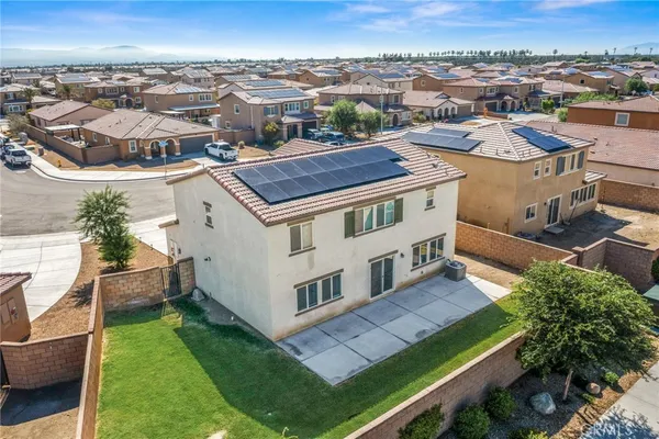 an aerial view of a house with a garden