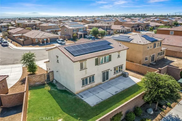 an aerial view of a house with a garden