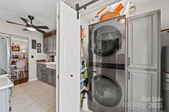 a view of wooden door with a glass door