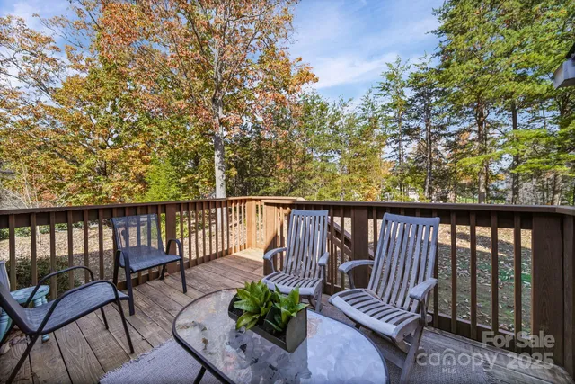 a view of balcony with furniture and wooden deck
