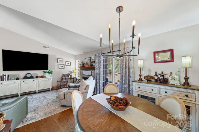 a living room with furniture and flat screen tv