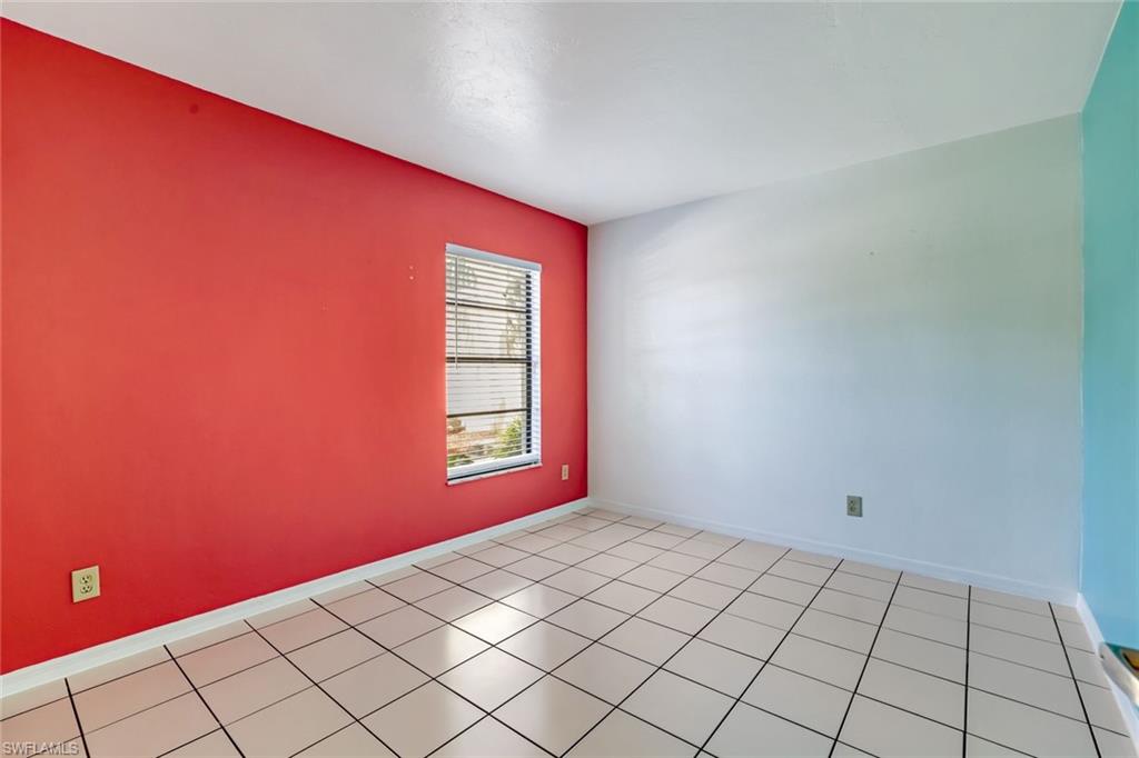 5501 Rattlesnake Hamm Road, Unit 109 Naples, FL 34113 - Photo 13 of 17 a view of an empty room and window