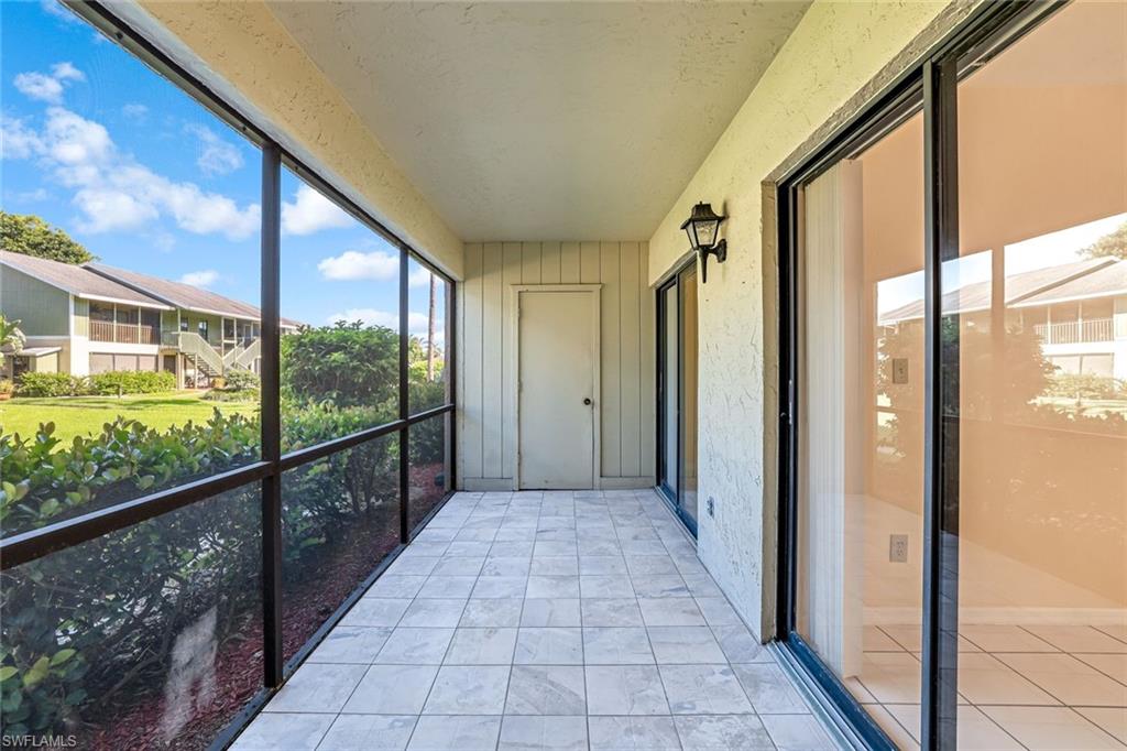 5501 Rattlesnake Hamm Road, Unit 109 Naples, FL 34113 - Photo 15 of 17 a view of a city from a balcony