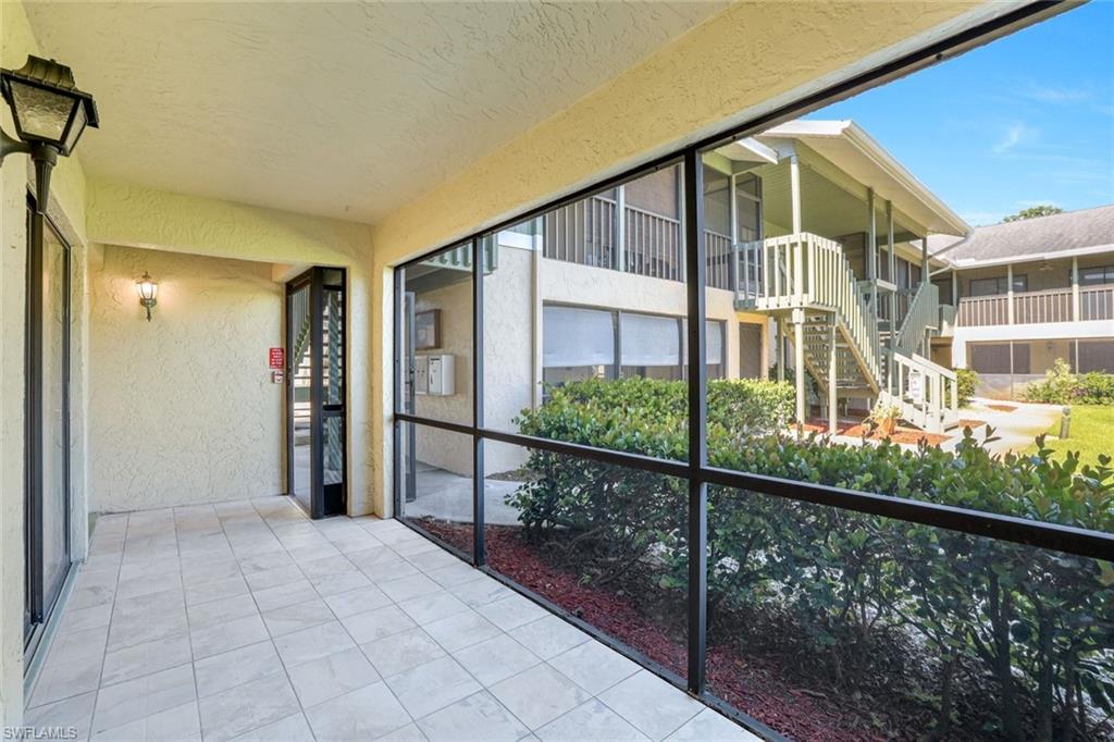 5501 Rattlesnake Hamm Road, Unit 109 Naples, FL 34113 - Photo 2 of 17 a view of a balcony