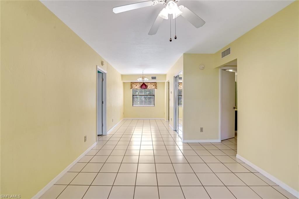 5501 Rattlesnake Hamm Road, Unit 109 Naples, FL 34113 - Photo 5 of 17 a view of an empty room and a window