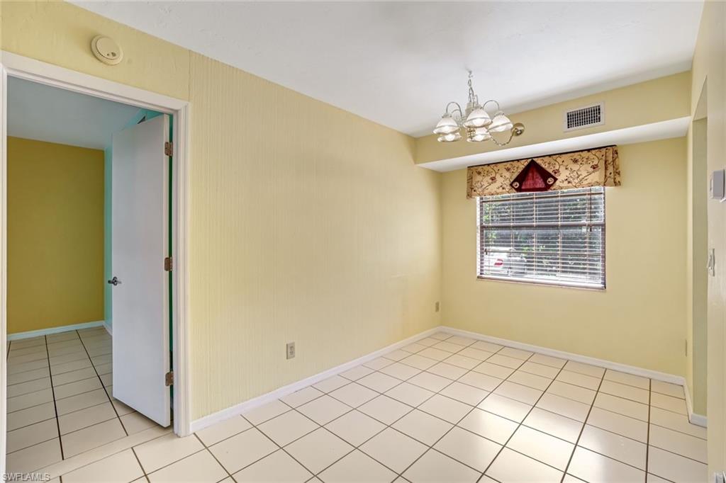 5501 Rattlesnake Hamm Road, Unit 109 Naples, FL 34113 - Photo 9 of 17 a view of livingroom with window