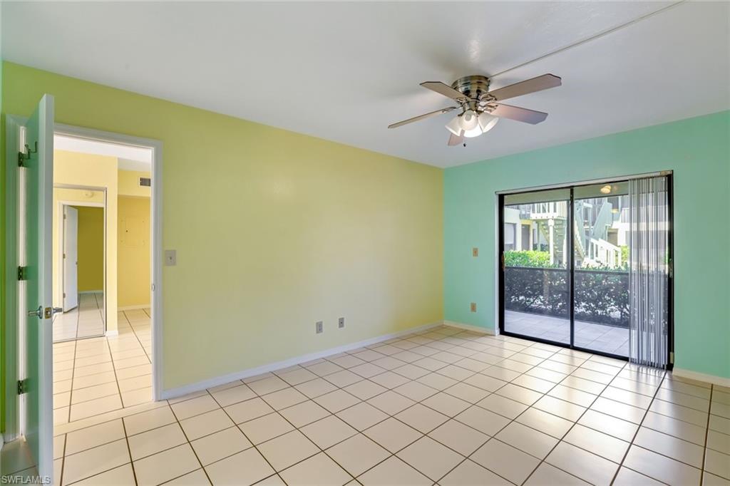 5501 Rattlesnake Hamm Road, Unit 109 Naples, FL 34113 - Photo 10 of 17 a view of an empty room with a window