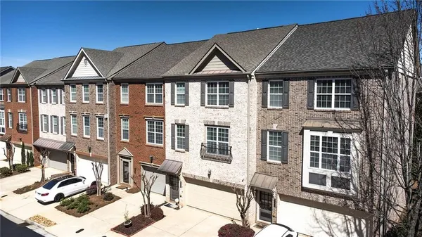 a front view of a house with many windows