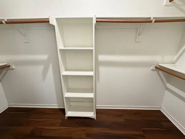 a view of an empty walk in closet