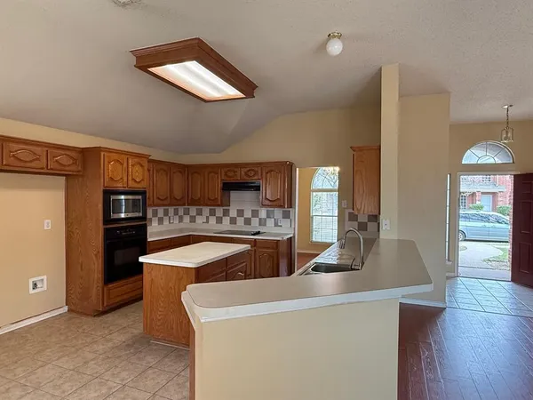 a view of living room with furniture and wooden floor
