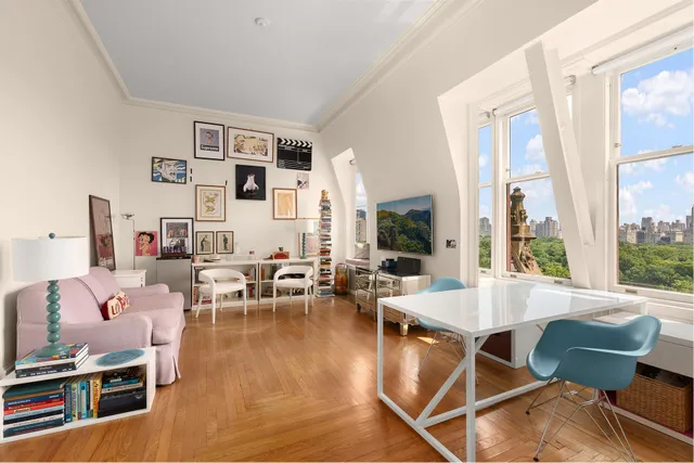 a living room with furniture pool table and a large window