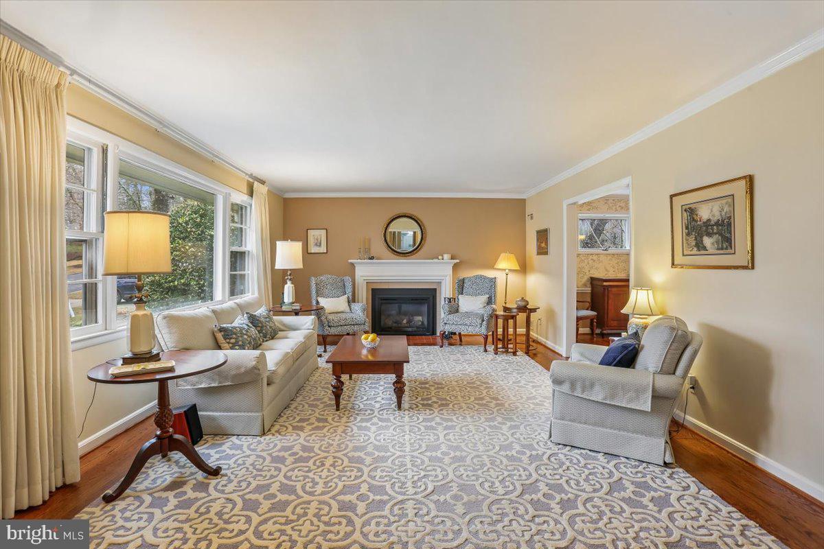 3612 Littledale Road Kensington, MD 20895 - Photo 10 of 79 a living room with furniture fireplace and a large window