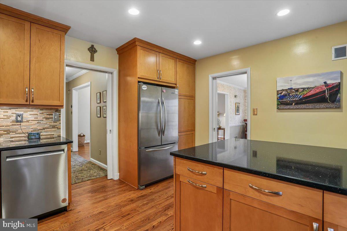 3612 Littledale Road Kensington, MD 20895 - Photo 24 of 79 a kitchen with stainless steel appliances granite countertop a refrigerator and a sink