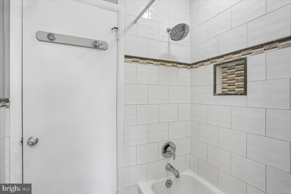 3612 Littledale Road Kensington, MD 20895 - Photo 43 of 79 a bathroom with a shower and a bathtub