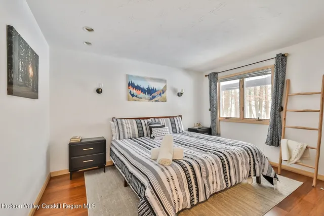 a en suite bathroom with a toilet a sink and a mirror