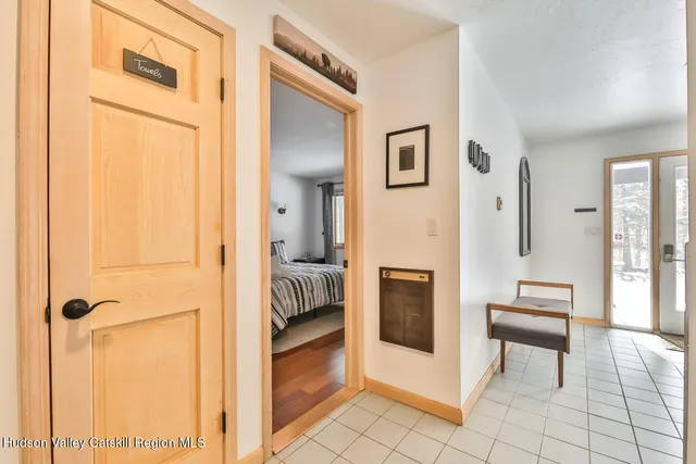 a living room with furniture a fireplace and a window
