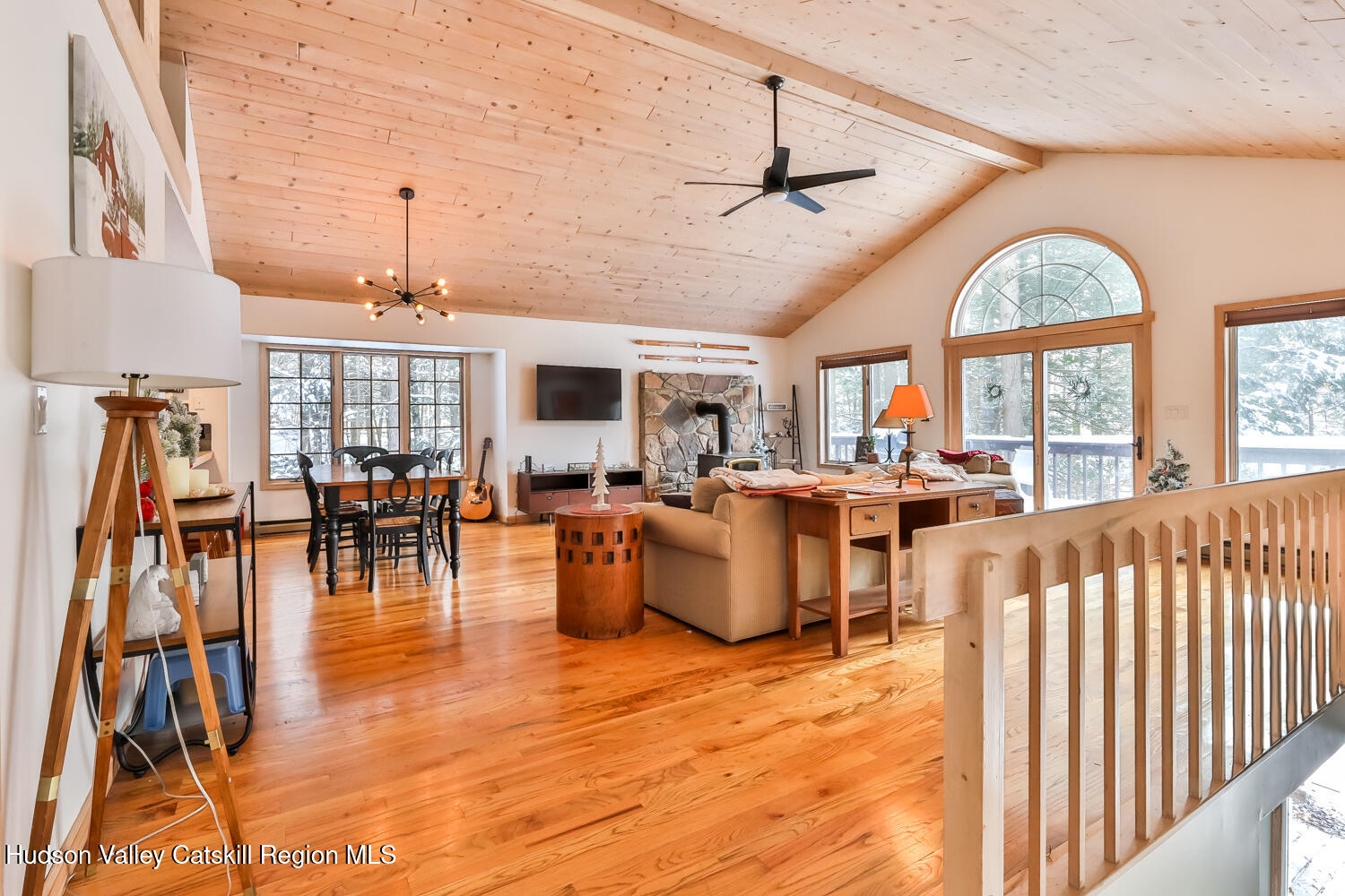 31 Koonan Road Windham, NY 12496 - Photo 22 of 48 a living room with lots of furniture and a chandelier
