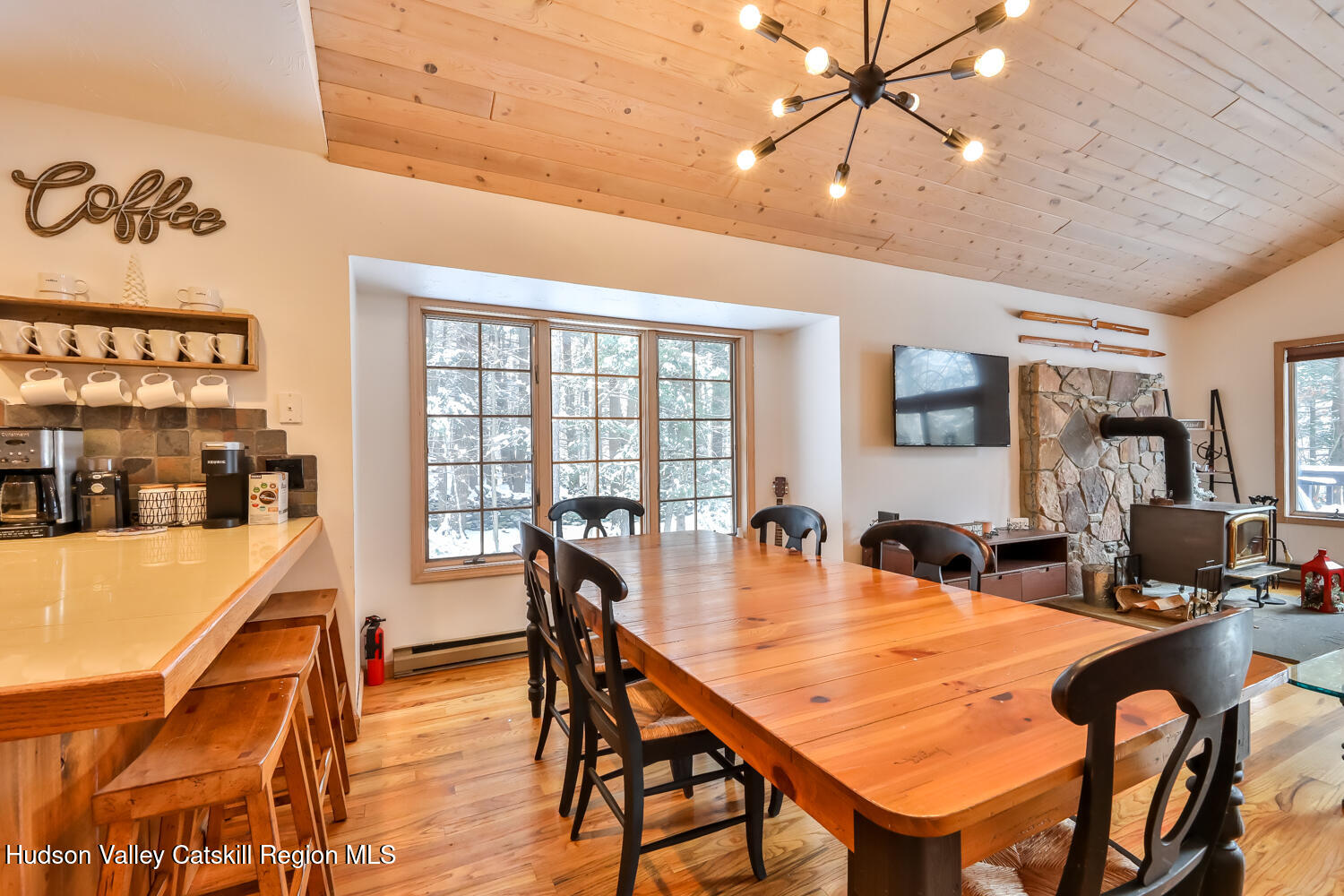 31 Koonan Road Windham, NY 12496 - Photo 28 of 48 a dining room with furniture a chandelier and wooden floor