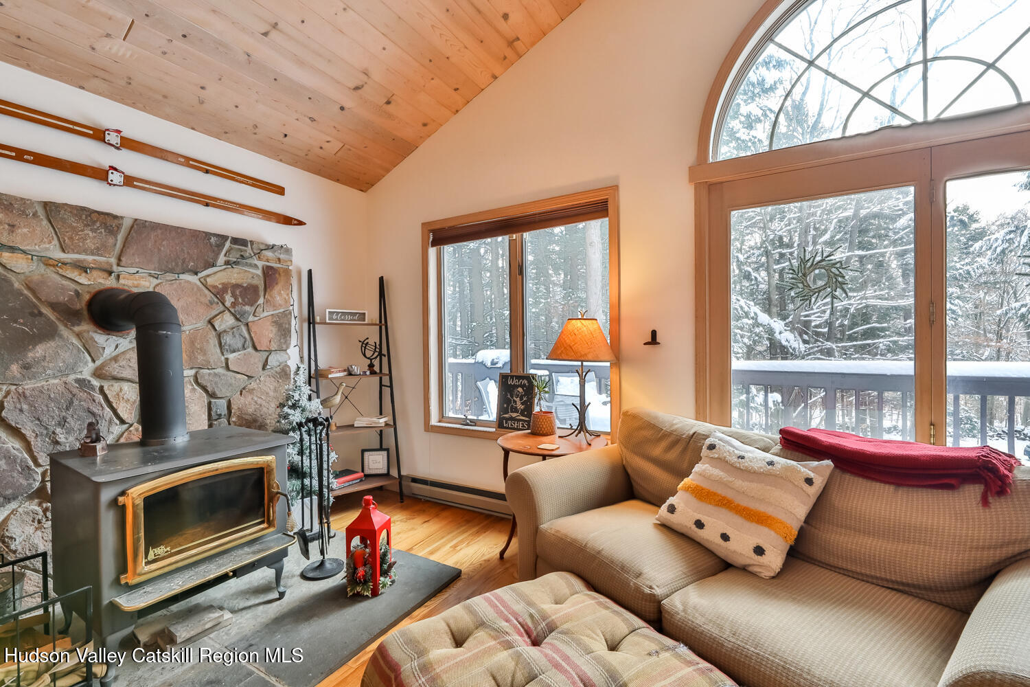 31 Koonan Road Windham, NY 12496 - Photo 33 of 48 a living room with furniture a fireplace and a window