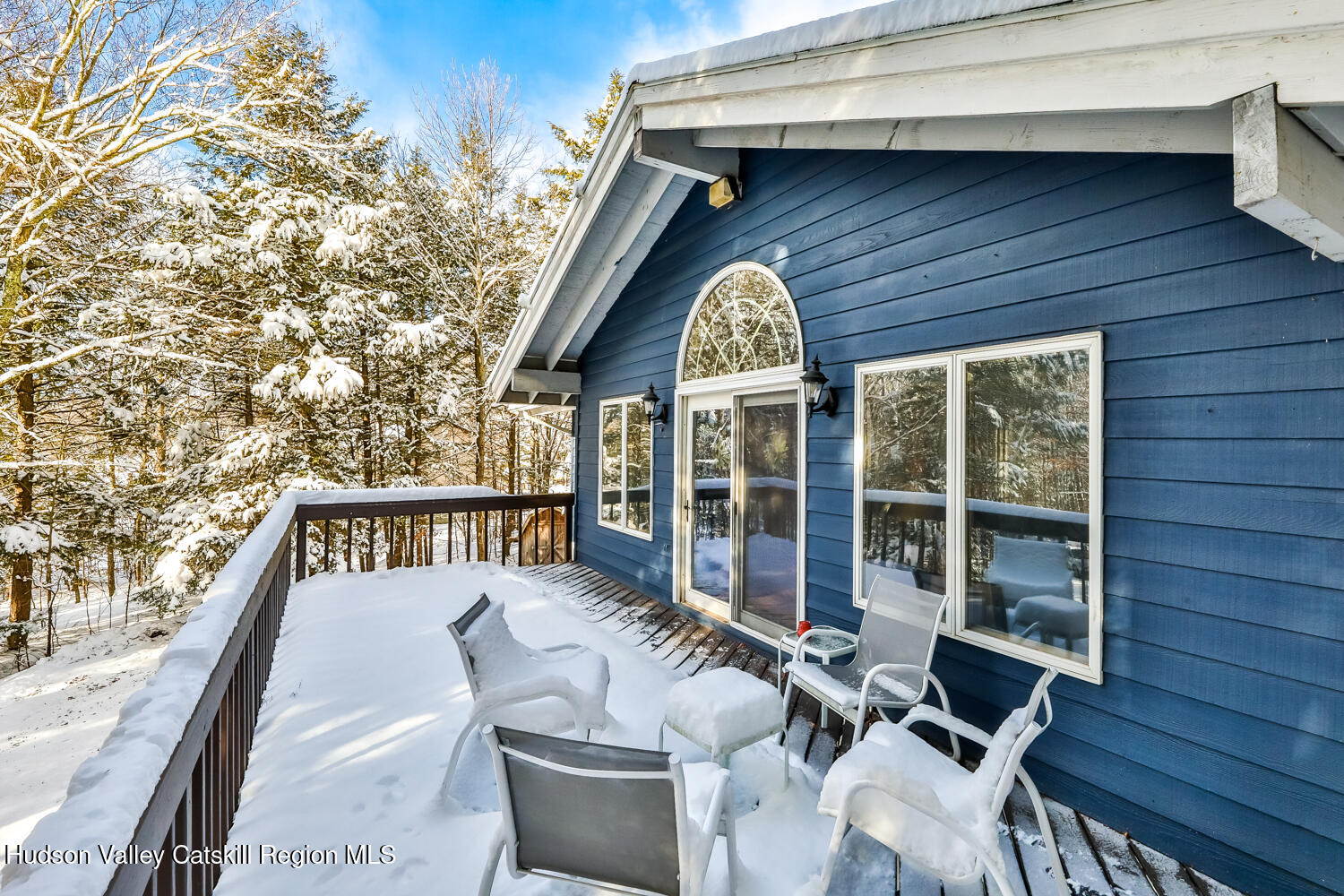 31 Koonan Road Windham, NY 12496 - Photo 42 of 48 a view of balcony with two chairs and a large window