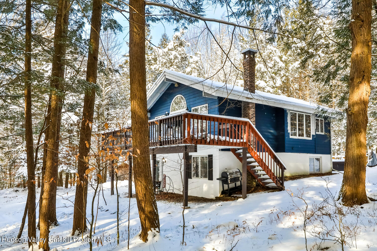 31 Koonan Road Windham, NY 12496 - Photo 5 of 48 a view of a wooden house with large trees and wooden fence