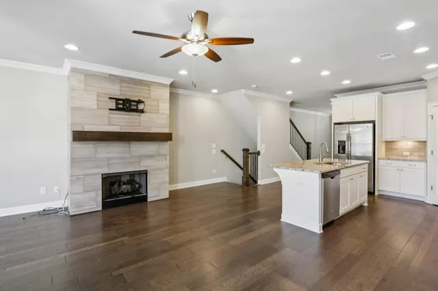 a living room with furniture and a fireplace
