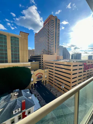 a view of a chairs and table in the balcony