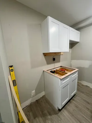 a stove top oven sitting inside of a kitchen