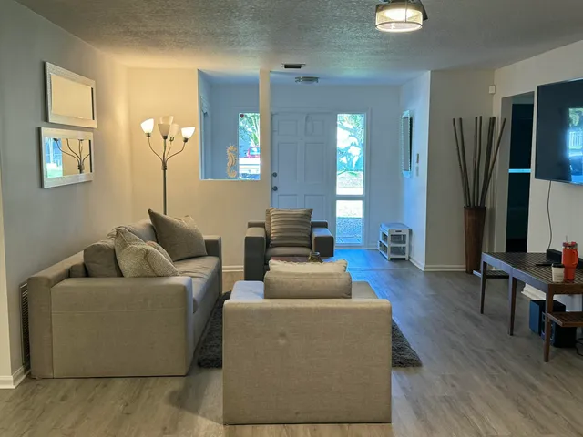 a living room with furniture and a window