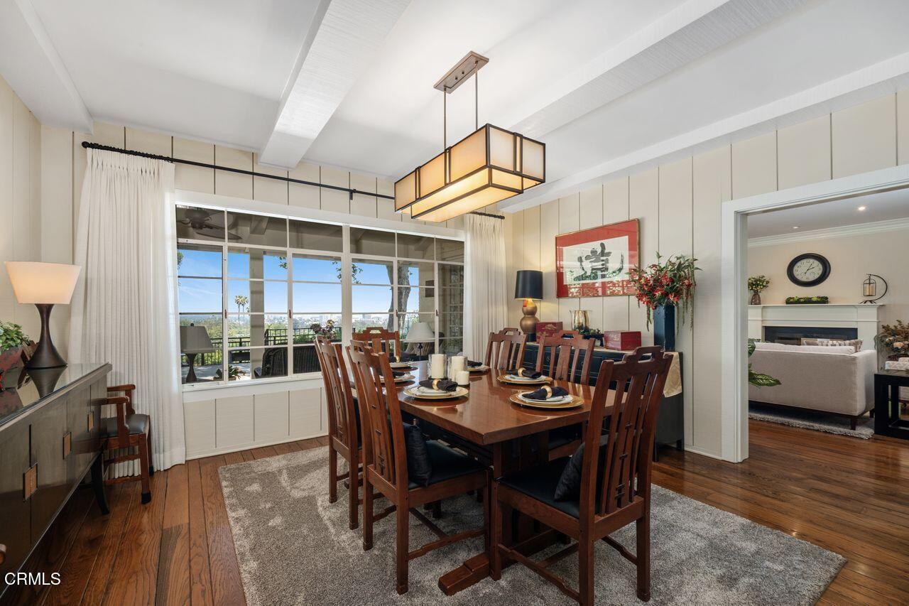 320 North San Rafael Avenue Pasadena, CA 91105 - Photo 14 of 58 a view of a dining room and livingroom with furniture wooden floor a chandelier