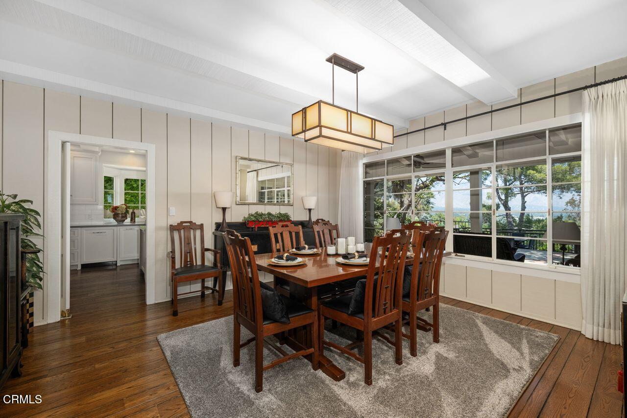 320 North San Rafael Avenue Pasadena, CA 91105 - Photo 15 of 58 a dining room with furniture a chandelier and wooden floor