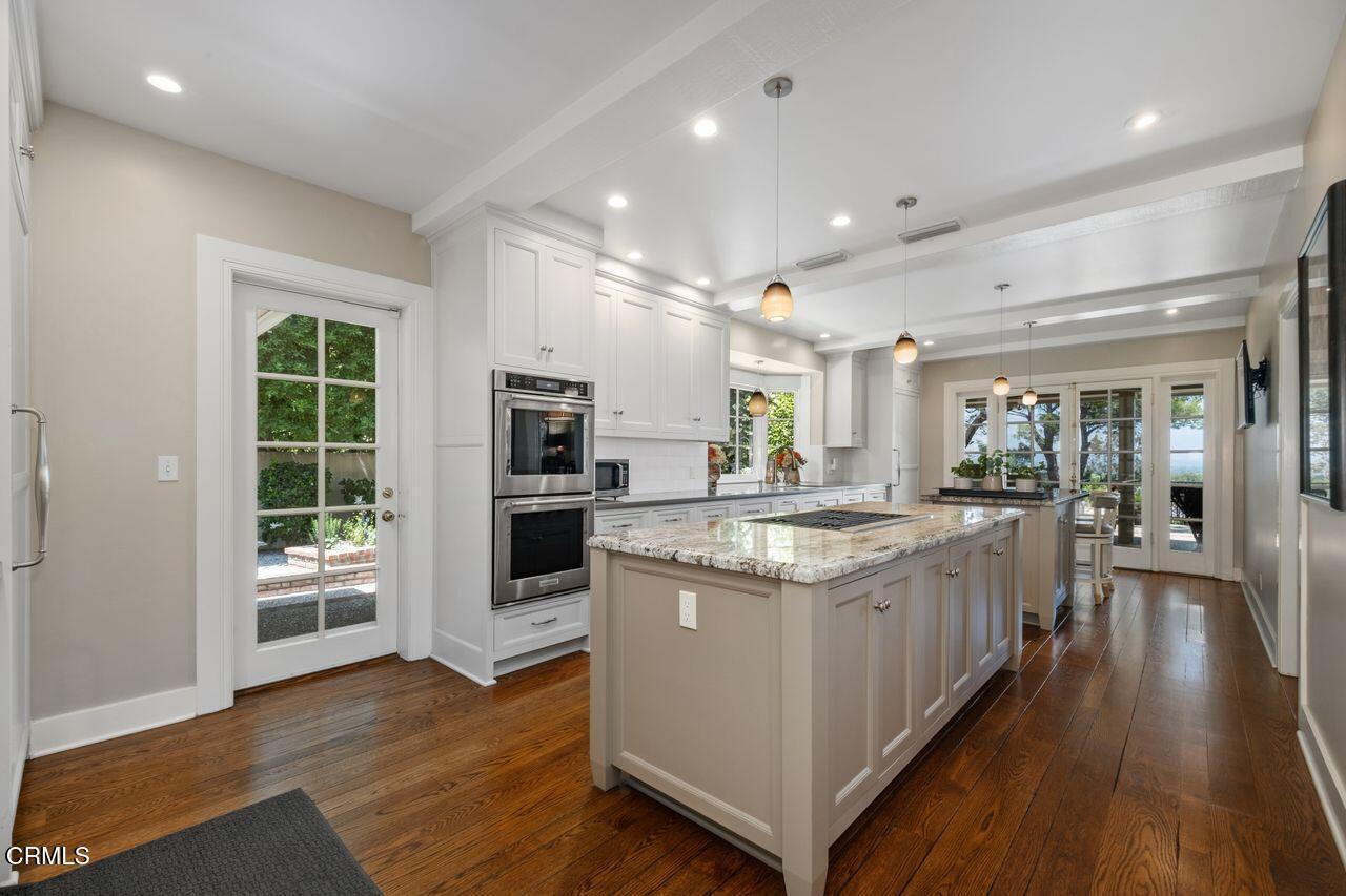 320 North San Rafael Avenue Pasadena, CA 91105 - Photo 19 of 58 a kitchen with a stove and a wooden floor