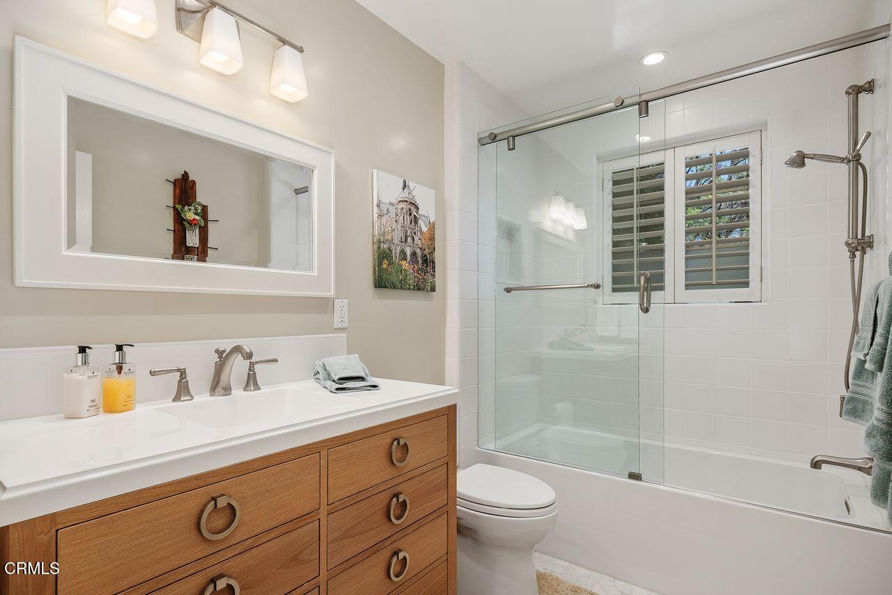 320 North San Rafael Avenue Pasadena, CA 91105 - Photo 24 of 58 a bathroom with a bathtub shower sink vanity and toilet