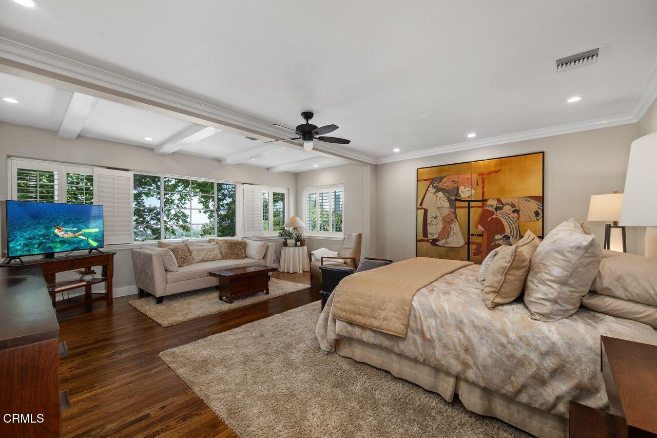 320 North San Rafael Avenue Pasadena, CA 91105 - Photo 28 of 58 a bedroom with a large bed and a couch