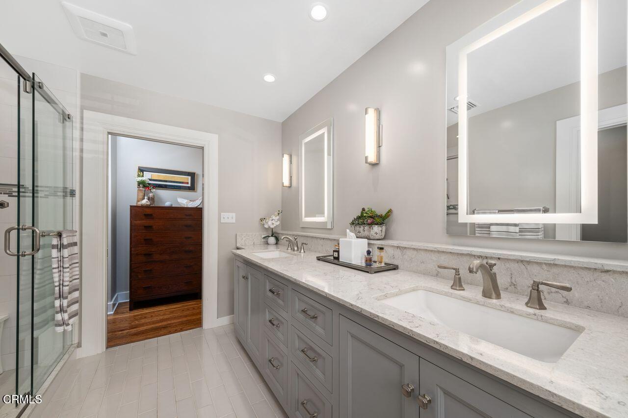 320 North San Rafael Avenue Pasadena, CA 91105 - Photo 30 of 58 a bathroom with double sink and a mirror