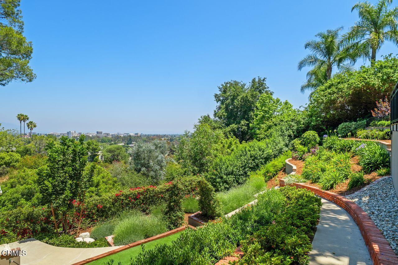 320 North San Rafael Avenue Pasadena, CA 91105 - Photo 48 of 58 a view of a garden with a building in the background