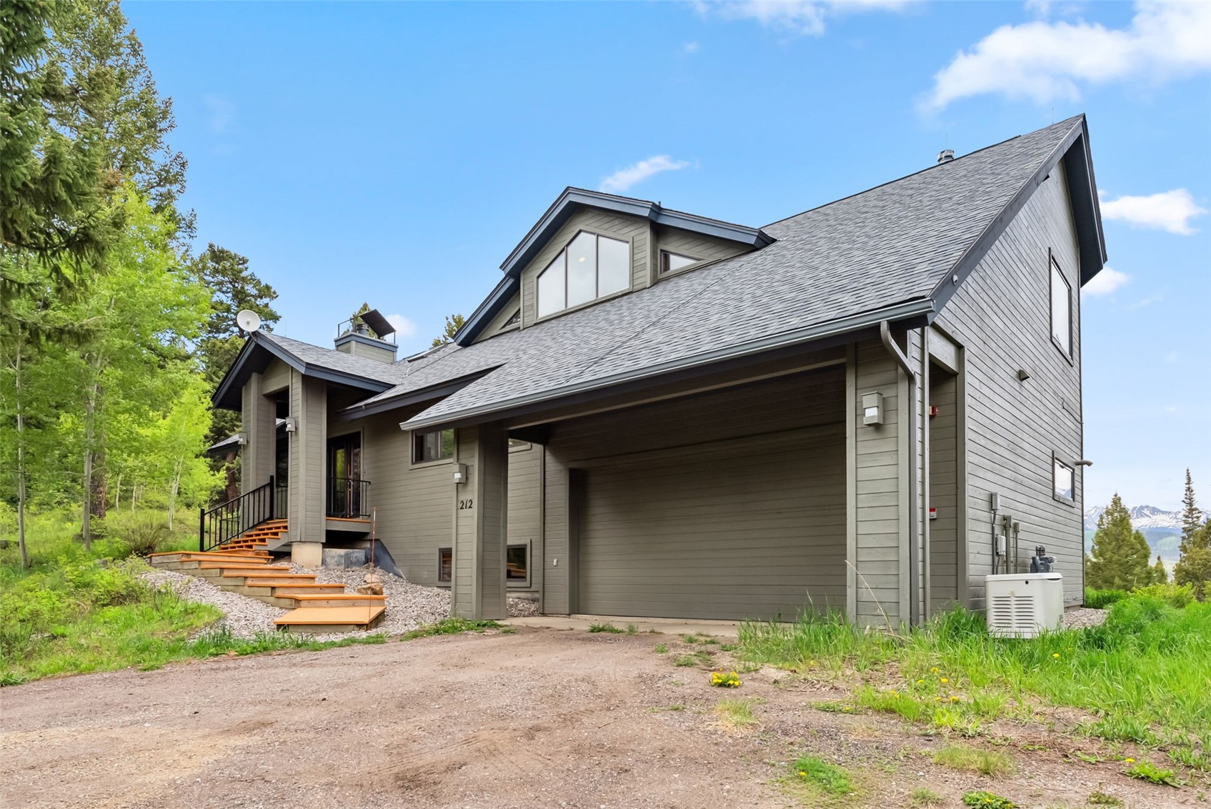 212 Spruce Ridge Road Silverthorne, CO 80498 - Photo 43 of 50 View of front of home featuring a shingled roof and gravel driveway