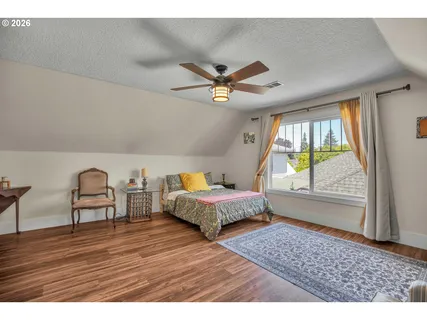 a bedroom with furniture and a window