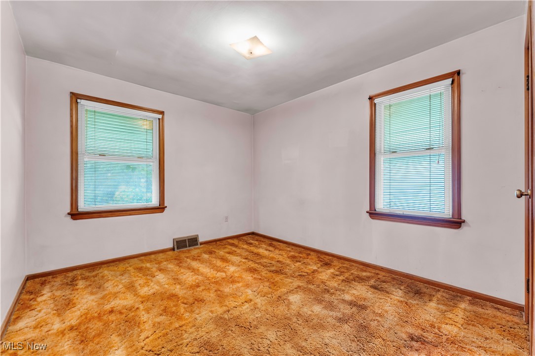 12931 Fruitside Road Garfield Heights, OH 44125 - Photo 10 of 15 Empty room featuring carpet