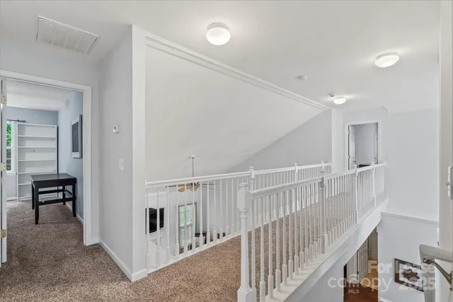 a view of a hallway with workspace