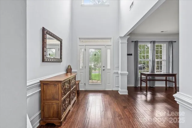 a view of a hardwood & staircase window