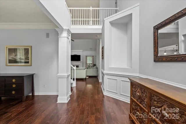 a kitchen with a refrigerator and a stove top oven