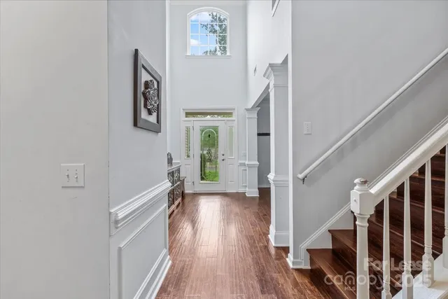 a view of entryway with stairs and wooden floor