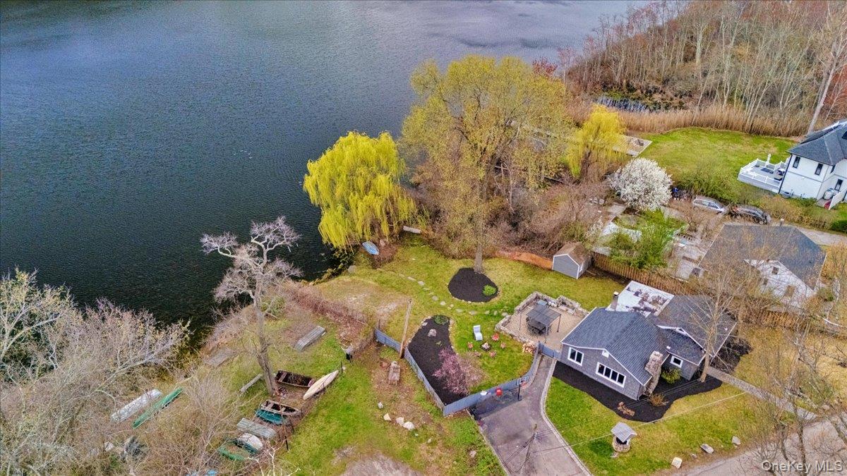 a bathroom with a sink mirror and painting on the wall